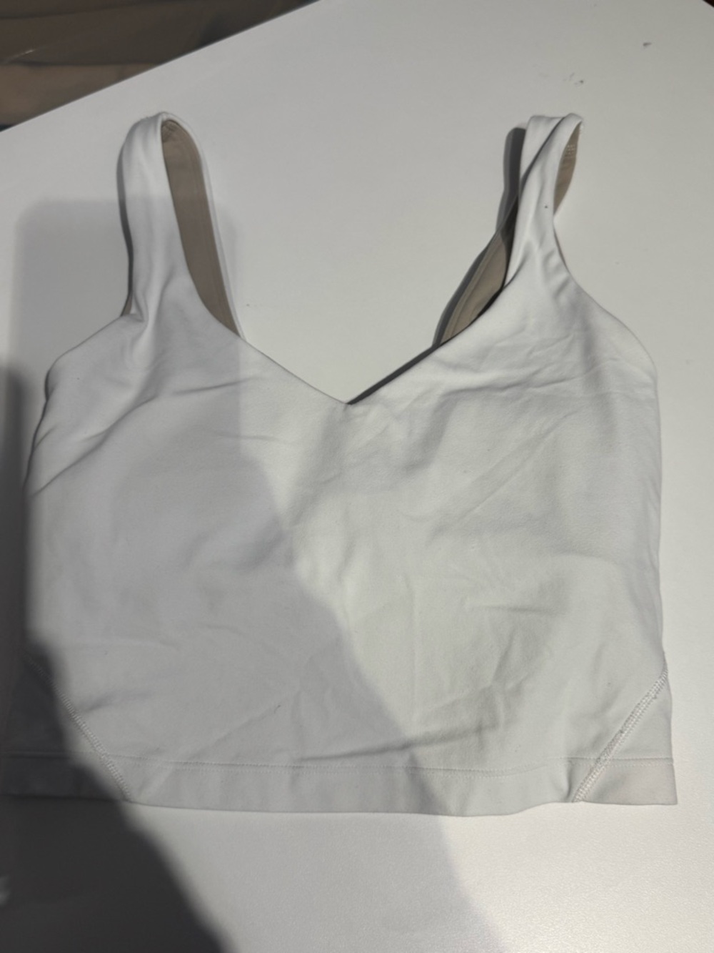 both Lululemon, my daughter took tags off I believe they are a size 0